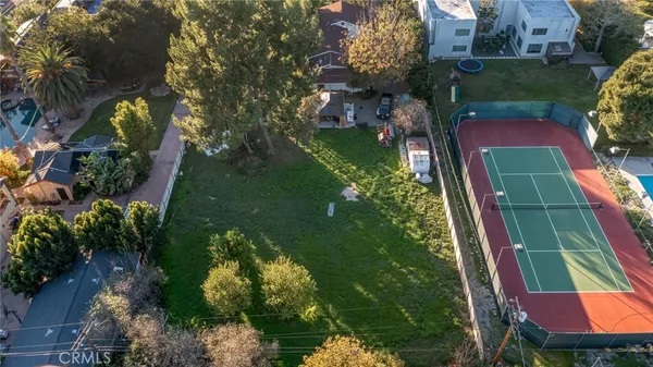 an aerial view of house with yard