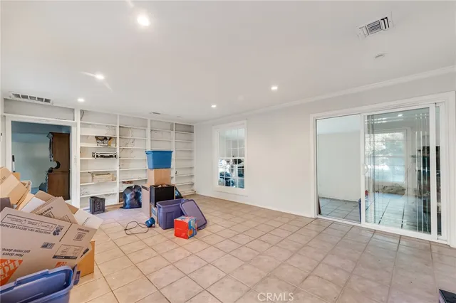 a bed room with a bed and lots of furniture