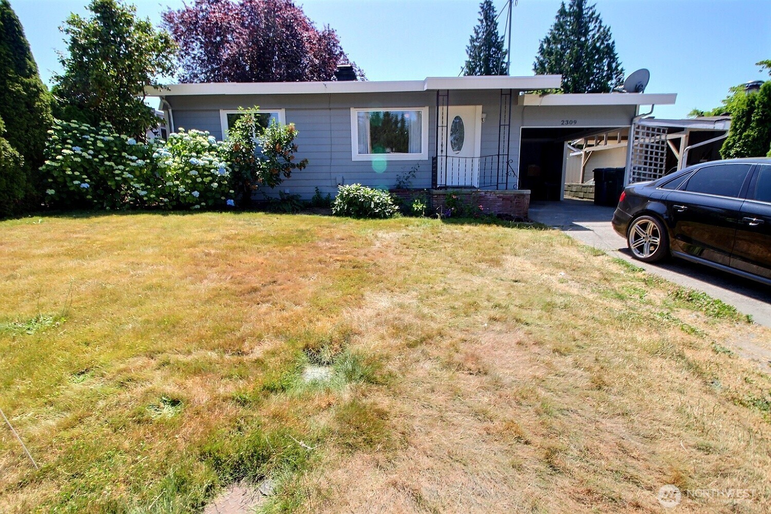2309 Northeast 9th Place Renton, WA 98056 - Photo 1 of 38 a view of house with yard and car parked