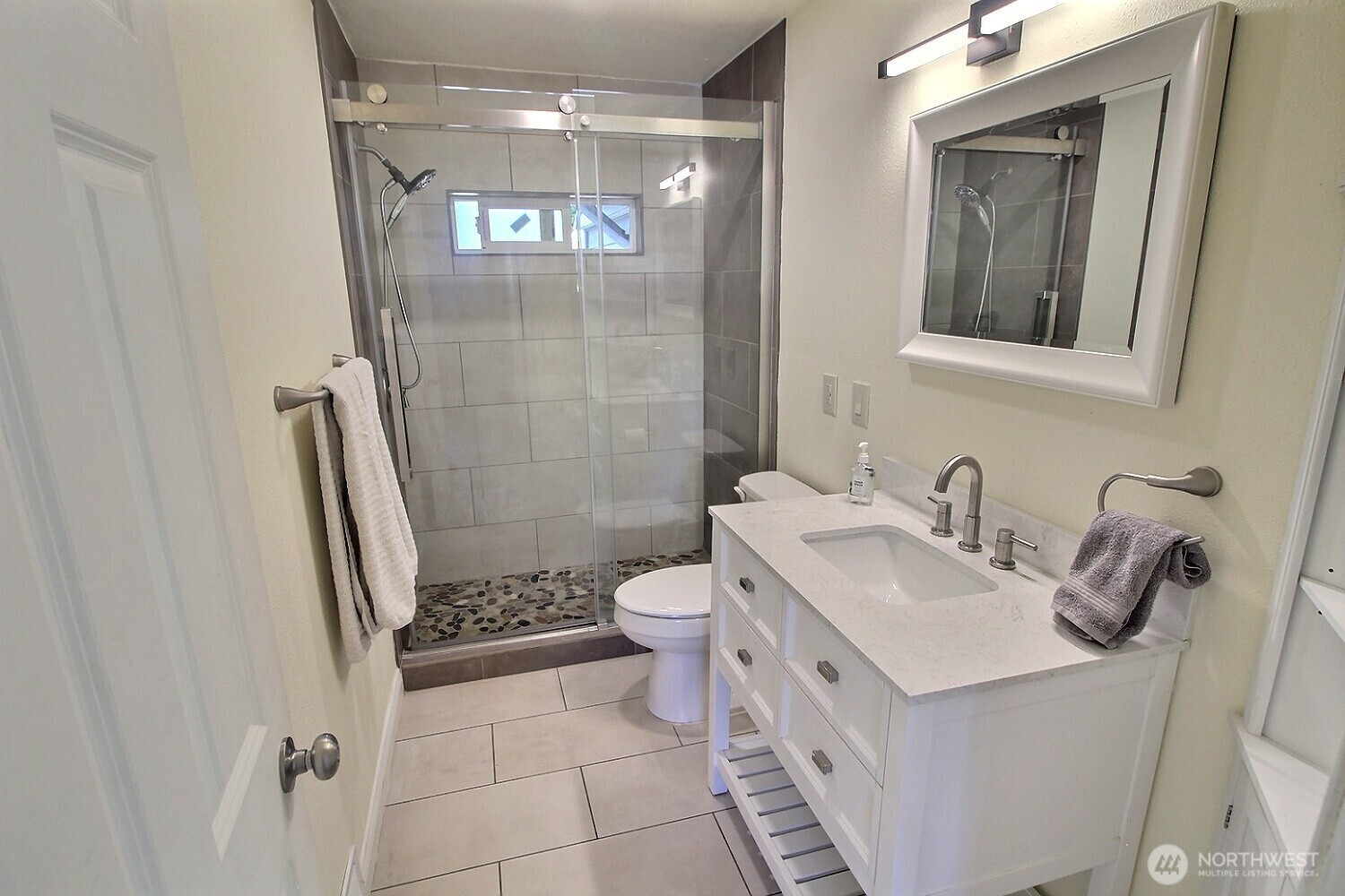 2309 Northeast 9th Place Renton, WA 98056 - Photo 14 of 38 a bathroom with a sink a toilet and shower