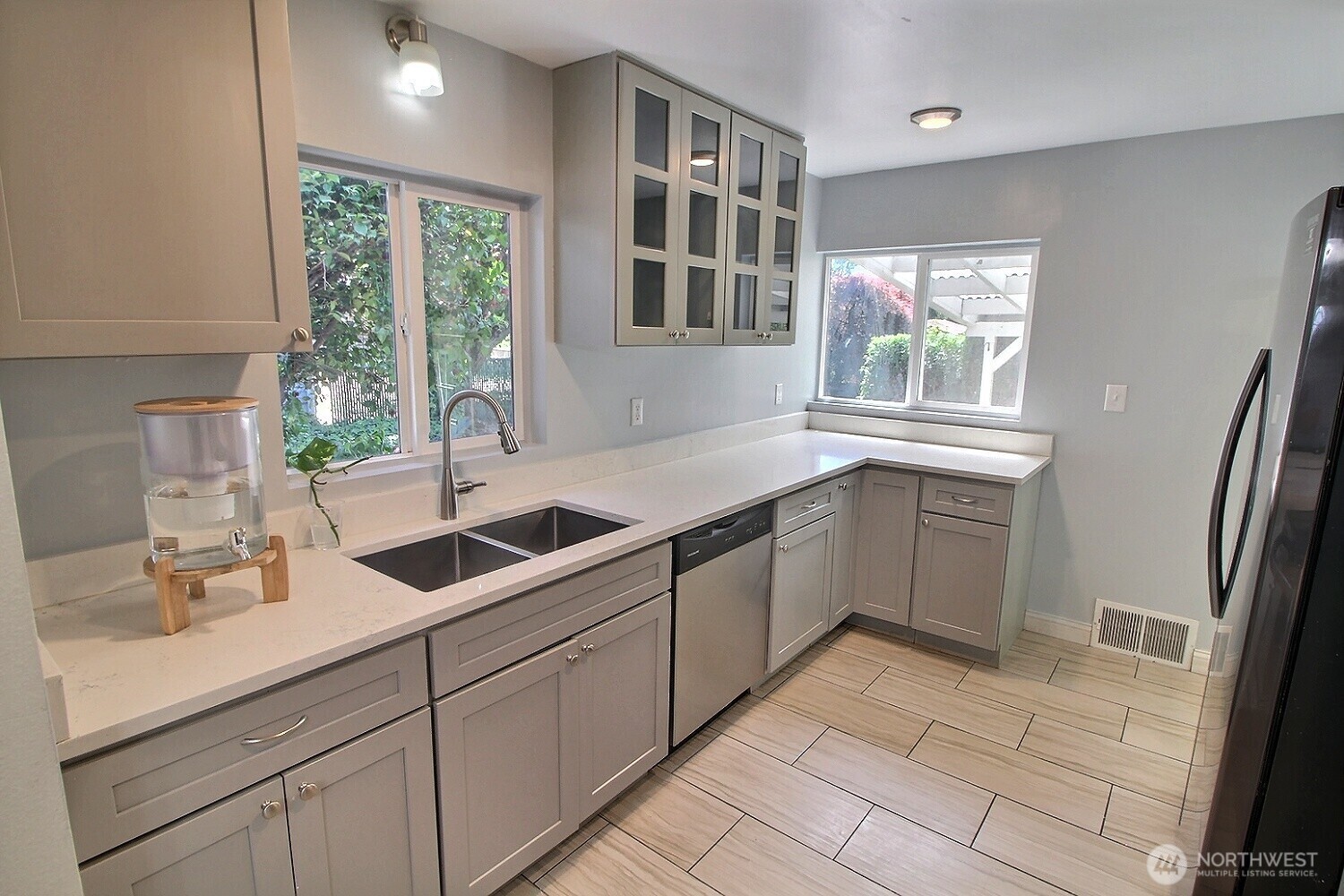 2309 Northeast 9th Place Renton, WA 98056 - Photo 6 of 38 a kitchen with a sink and cabinets