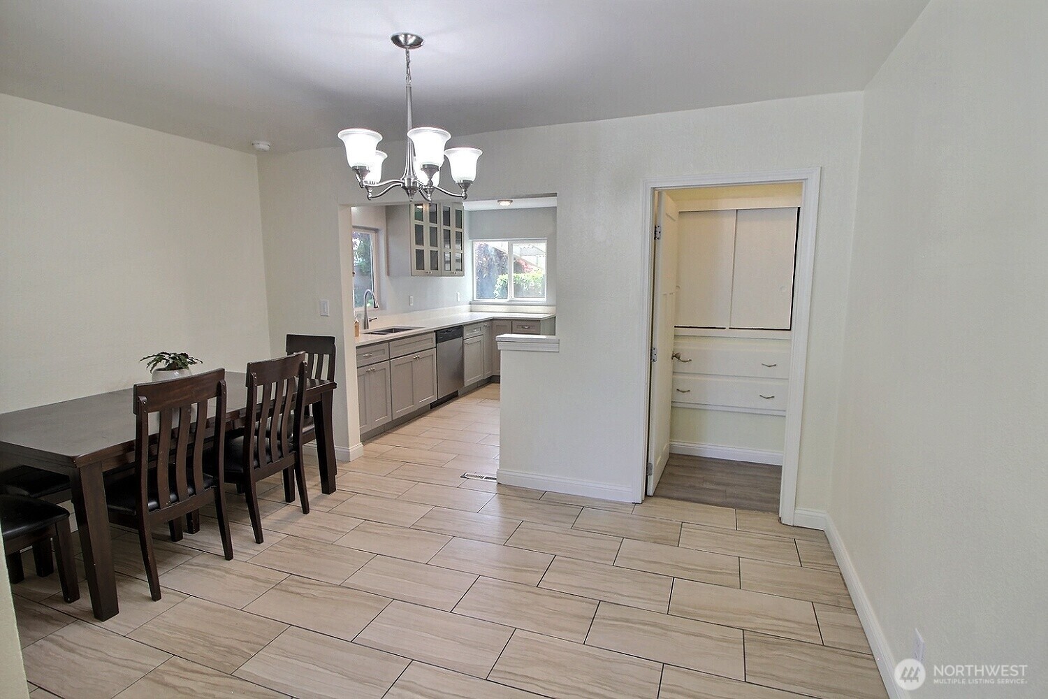 2309 Northeast 9th Place Renton, WA 98056 - Photo 7 of 38 a view of a dining room with furniture and chandelier