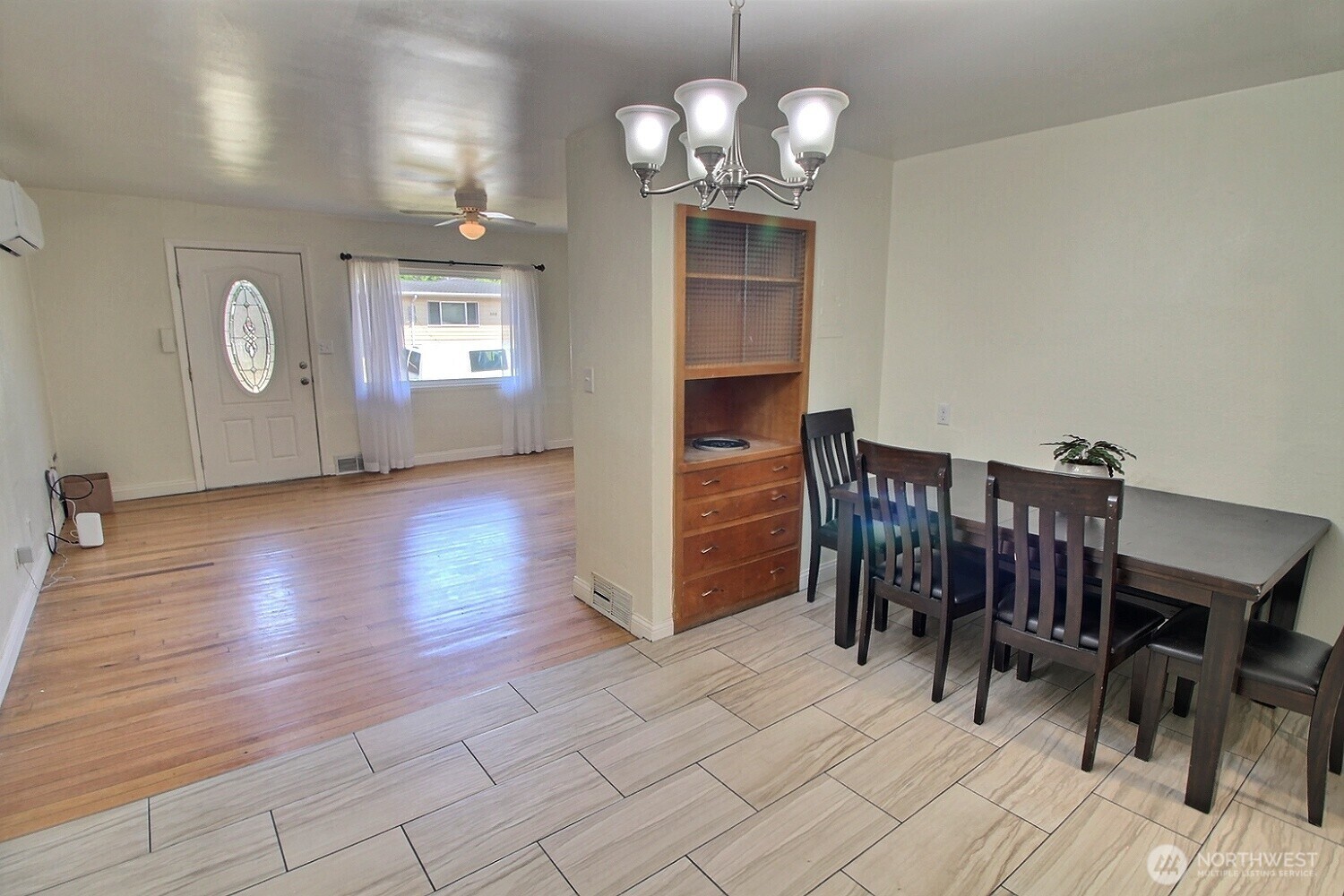 2309 Northeast 9th Place Renton, WA 98056 - Photo 8 of 38 a view of a dining room with furniture and wooden floor