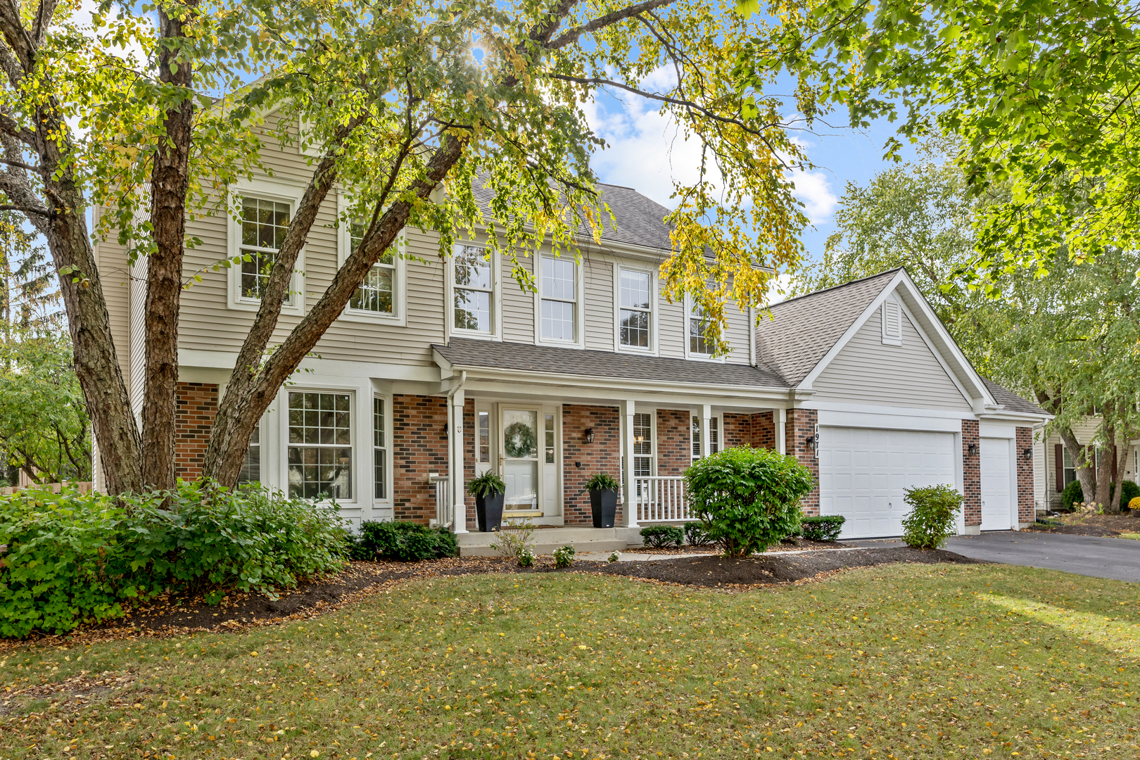 front view of a house with a yard