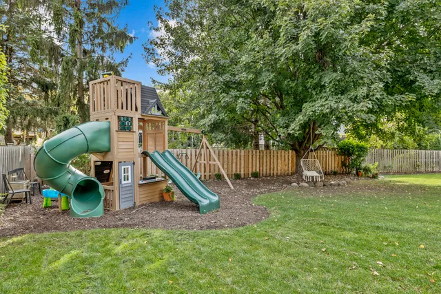 a view of a chair and table in the yard