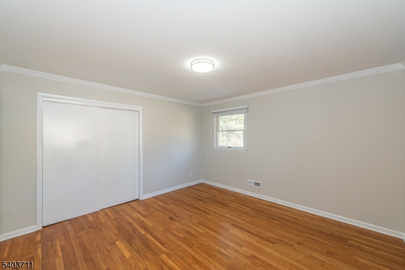 8 Abby Road Morristown, NJ 07960 - Photo 19 of 27 a view of empty room with wooden floor