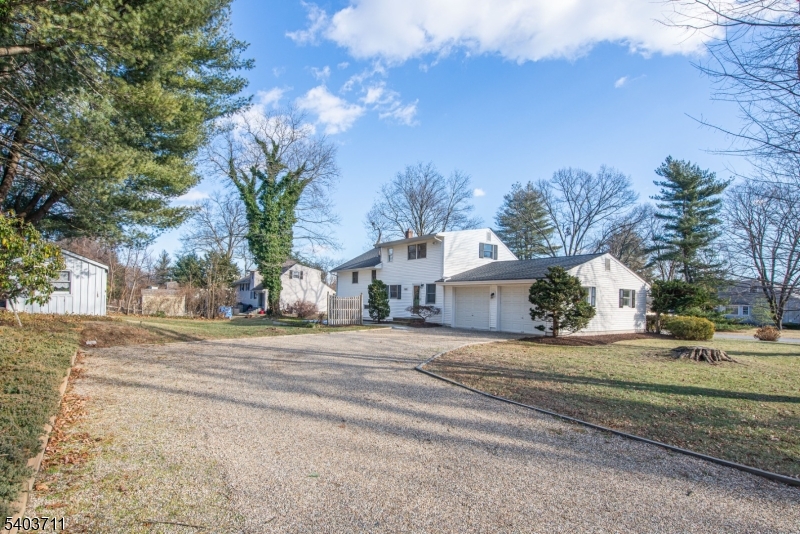 8 Abby Road Morristown, NJ 07960 - Photo 26 of 27 a front view of a house with a yard and garage