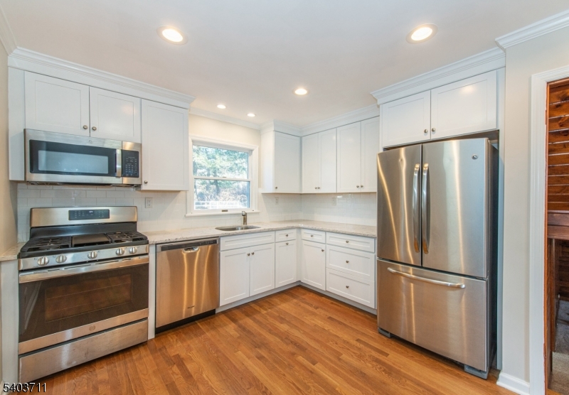 8 Abby Road Morristown, NJ 07960 - Photo 5 of 27 a kitchen with stainless steel appliances a refrigerator sink and microwave