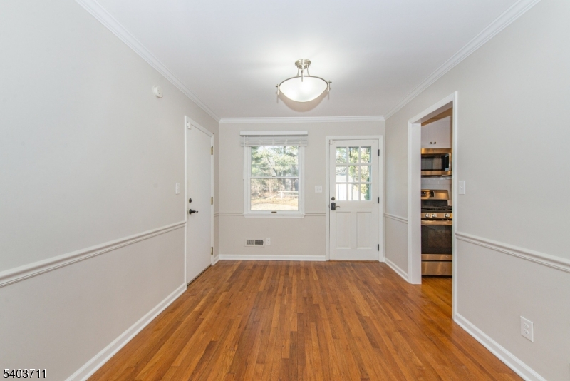 8 Abby Road Morristown, NJ 07960 - Photo 7 of 27 wooden floor in an empty room with a window