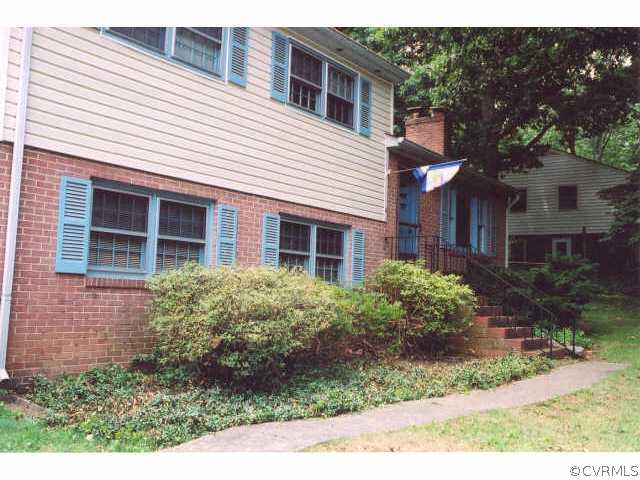 7111 Shawnee Road Richmond, VA 23225 - Photo 2 of 10 a front view of a house with garden