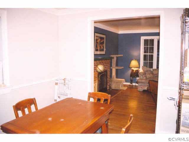 7111 Shawnee Road Richmond, VA 23225 - Photo 6 of 10 a living room with furniture and a wooden floor