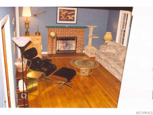 7111 Shawnee Road Richmond, VA 23225 - Photo 7 of 10 a living room with furniture and a fireplace