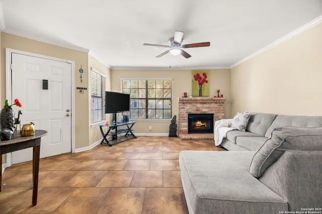 a view of a kitchen with a dining table and chairs