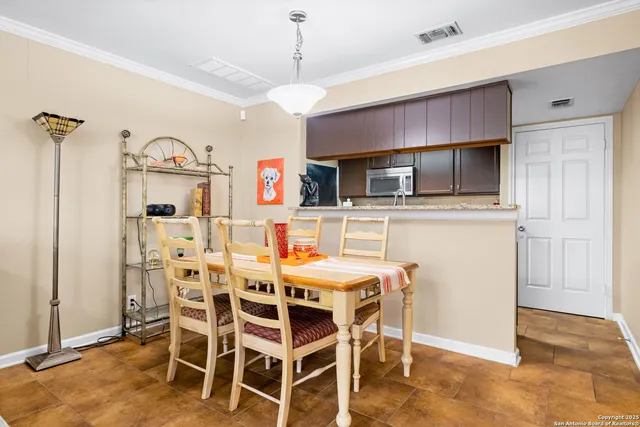 a bedroom with a bed and flowerpot