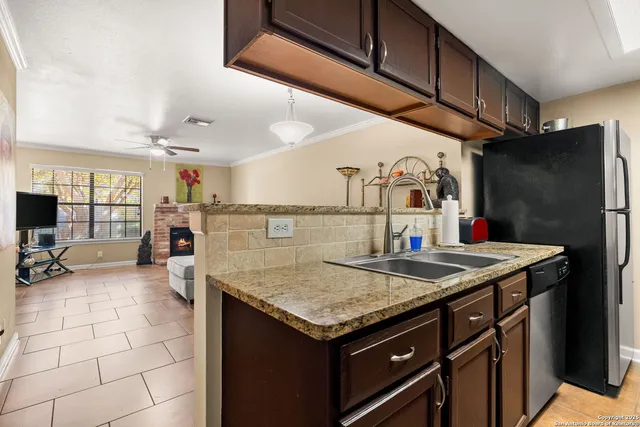 a bed room with a bed and a television