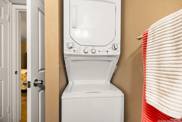 a view of a house with swimming pool and sitting area