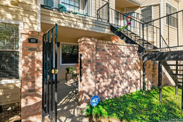 a view of a chairs and table in a patio