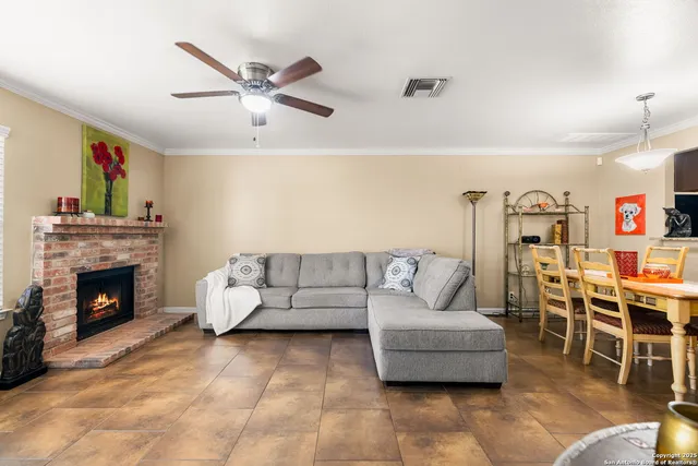 a living room with furniture and kitchen view