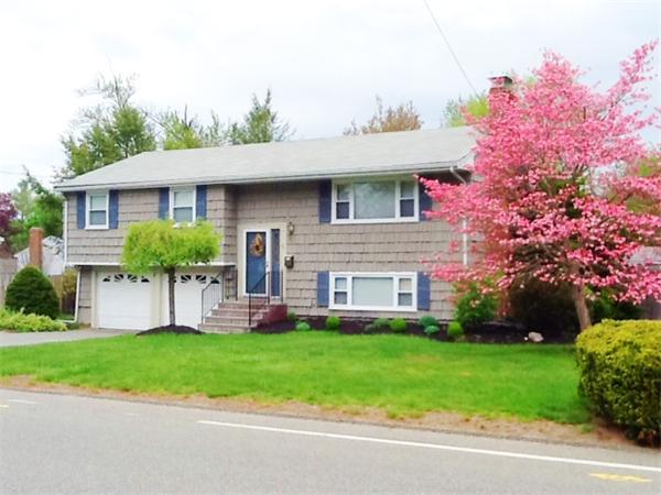 5 Fencourt Road Canton, MA 02021 - Photo 1 of 14 a front view of a house with a yard and potted plants