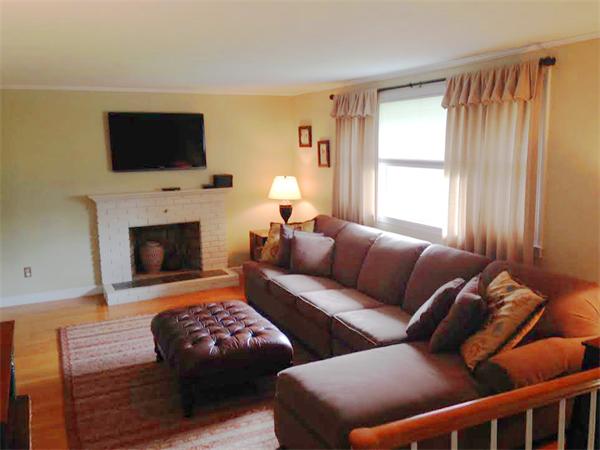 5 Fencourt Road Canton, MA 02021 - Photo 3 of 14 a living room with furniture fireplace and flat screen tv