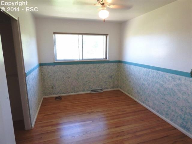 1556 Collins Road Colorado Springs, CO 80920 - Photo 13 of 25 Bedroom 2 with new wood flooring.