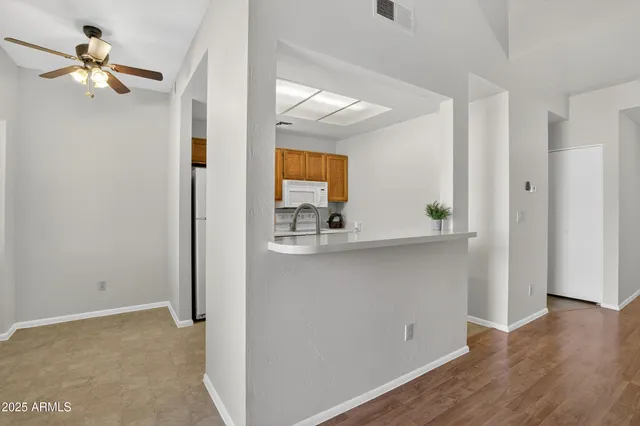a view of cabinets with wooden floor and a cabinet