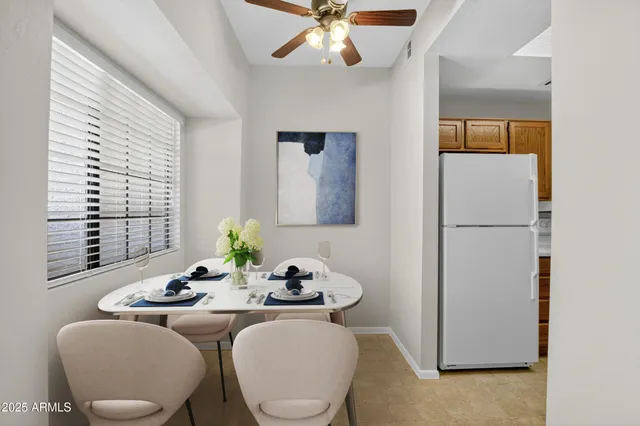 a living room with kitchen island furniture and a view of kitchen