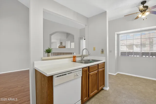 a kitchen with appliances cabinets and a sink