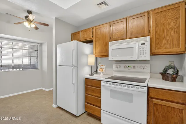 a kitchen with a sink and a refrigerator