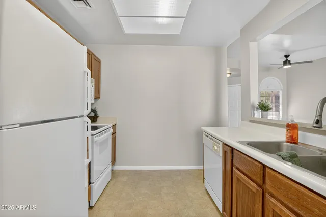 a living room with a fireplace and a wooden floor