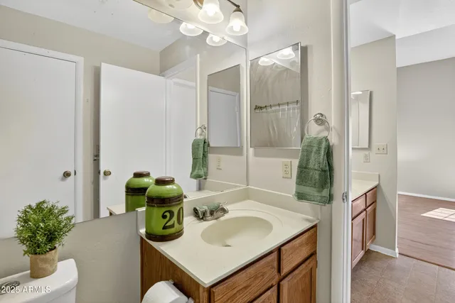 a bathroom with a tub sink and mirror