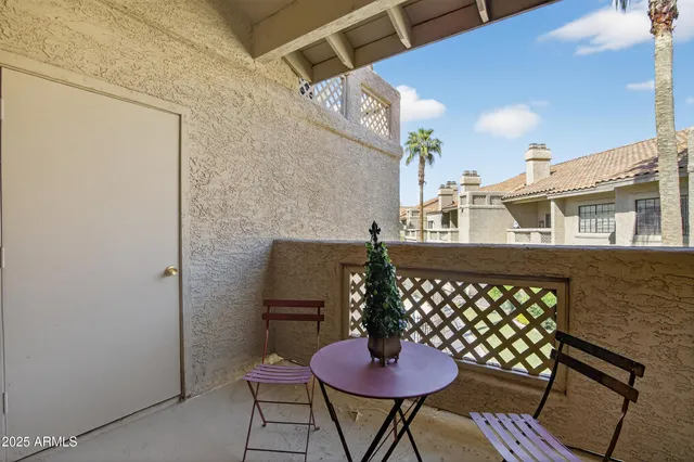 a dining room with furniture and front door