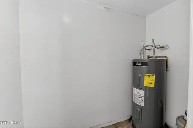a view of a livingroom with furniture and a potted plant