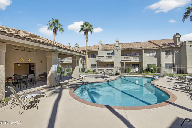a view of a house with sitting area and garden