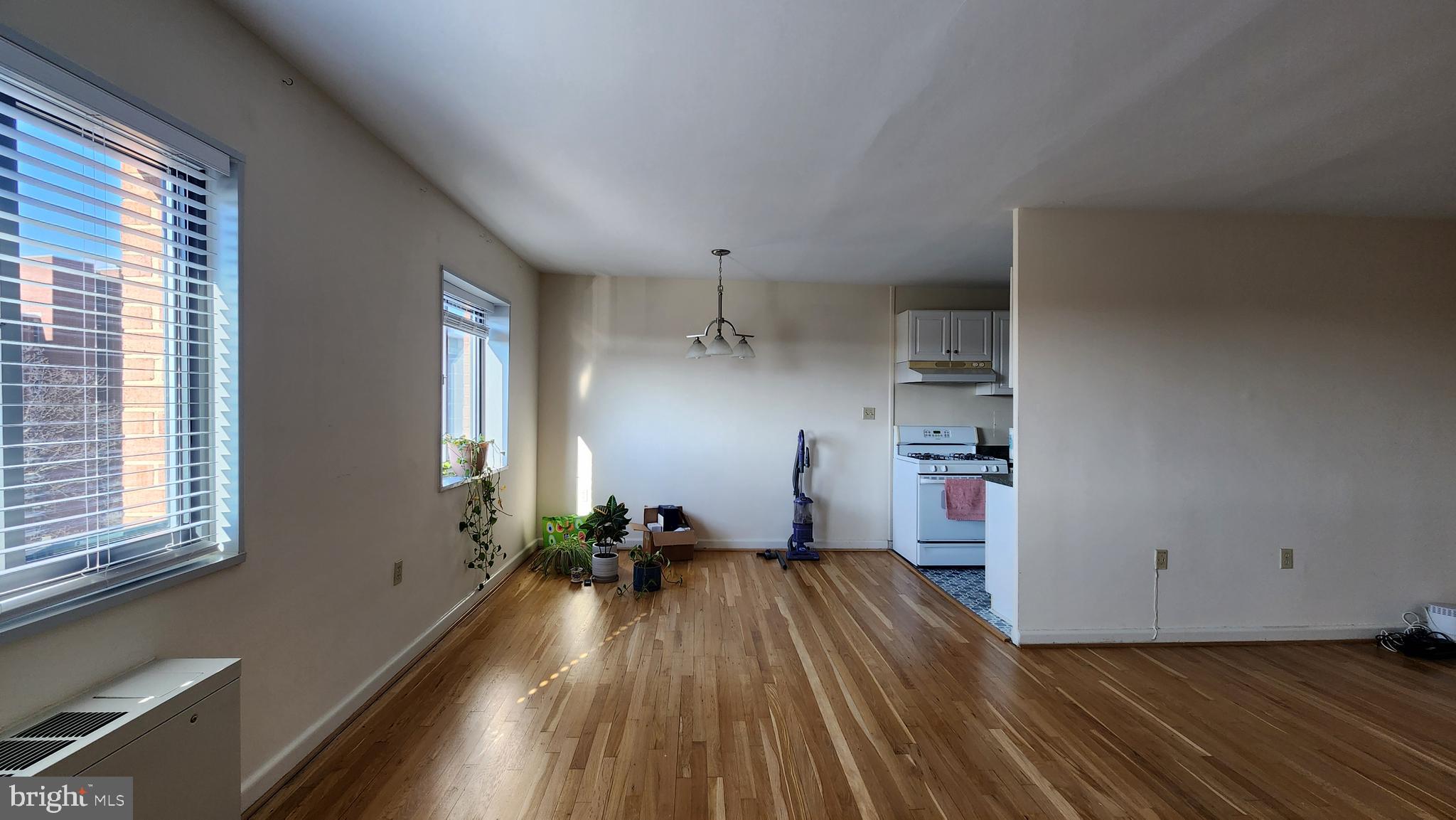 1200 South Arlington Ridge Road, Unit 701 Arlington, VA 22202 - Photo 3 of 12 a view of a room with wooden floor and windows