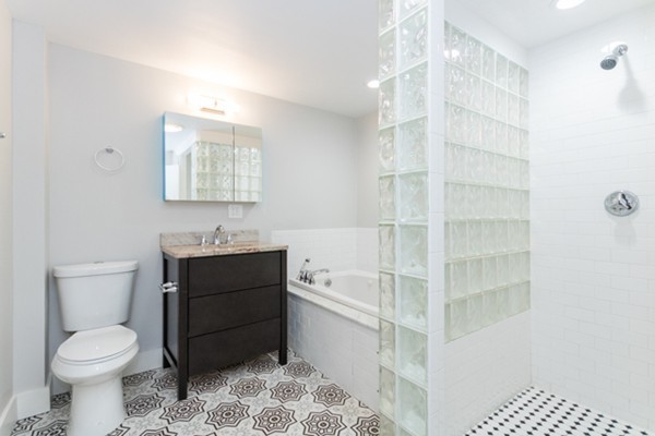 2 Sylvan Road Billerica, MA 01821 - Photo 7 of 12 a bathroom with a sink a toilet and shower
