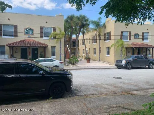 a front view of a house with parking space