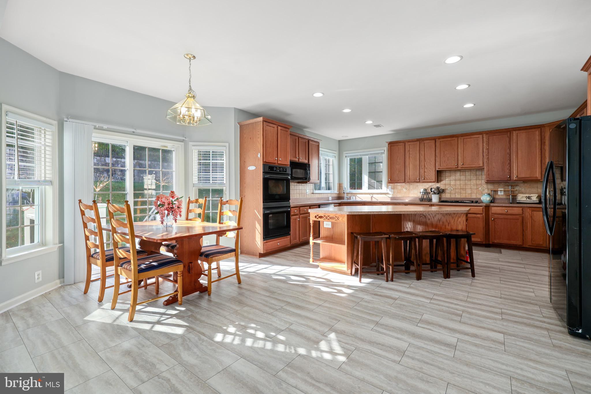 3671 Expedition Drive Triangle, VA 22172 - Photo 24 of 55 a view of a dining room with furniture window and wooden floor