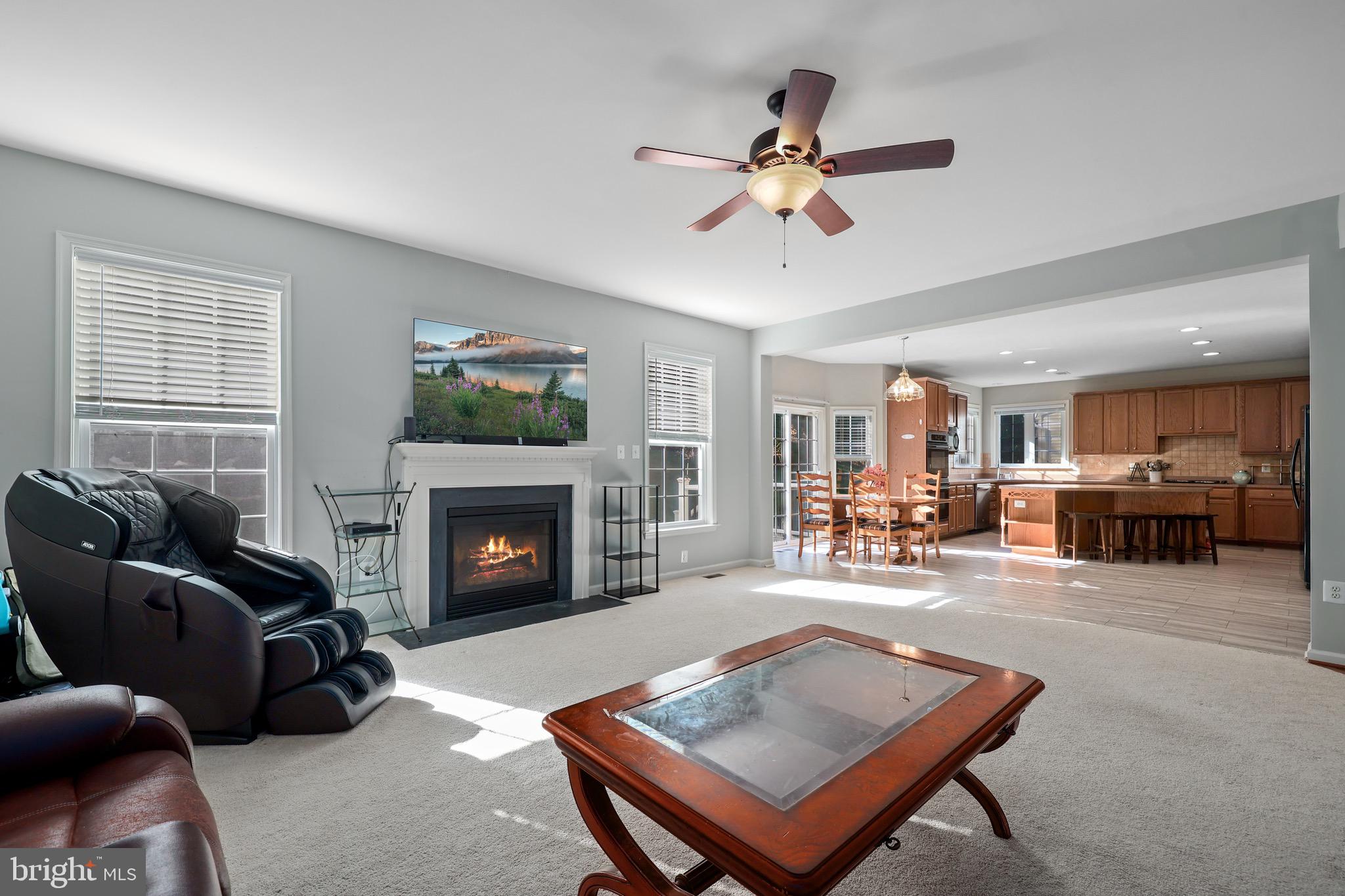 3671 Expedition Drive Triangle, VA 22172 - Photo 27 of 55 a living room with furniture a fireplace and a window