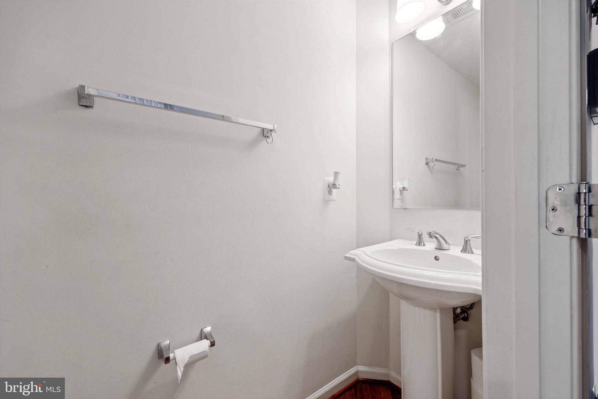 3671 Expedition Drive Triangle, VA 22172 - Photo 28 of 55 a bathroom with a sink a mirror and a toilet