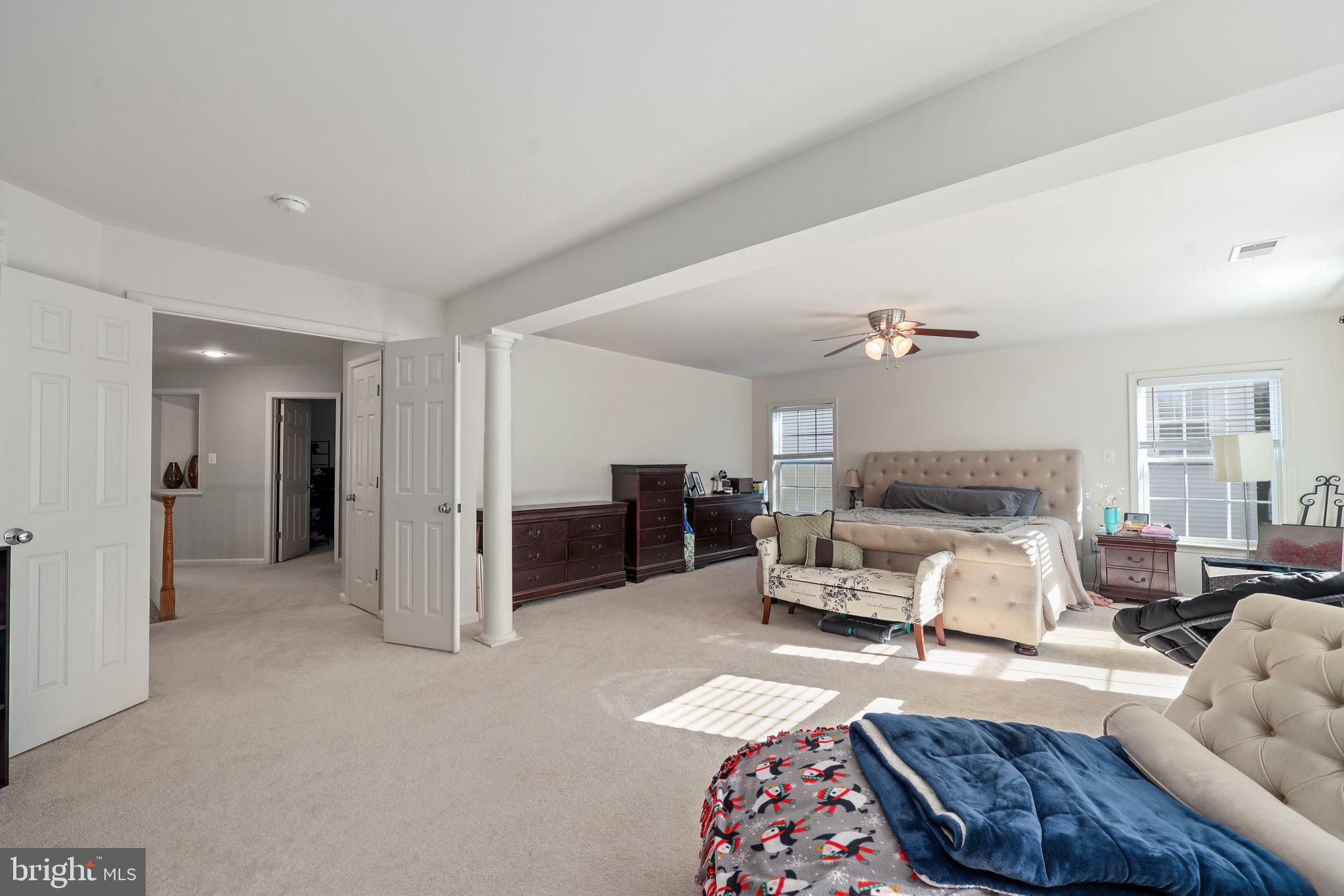 3671 Expedition Drive Triangle, VA 22172 - Photo 31 of 55 a bedroom with furniture and a chandelier
