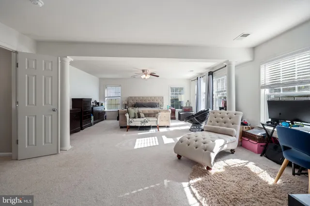 a bedroom with a bed and a table