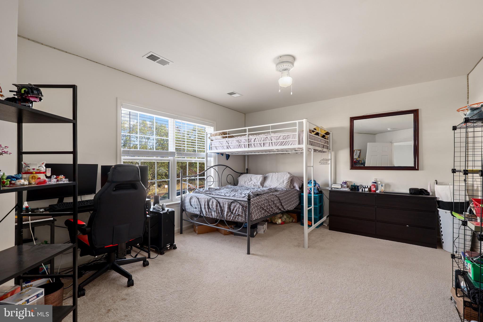 3671 Expedition Drive Triangle, VA 22172 - Photo 41 of 55 a bedroom with bed chair and window