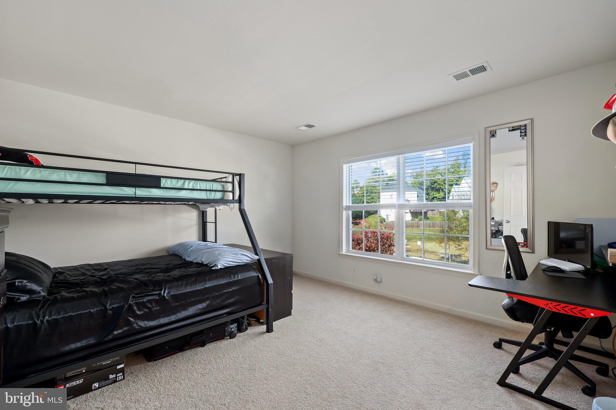 3671 Expedition Drive Triangle, VA 22172 - Photo 42 of 55 a bedroom with a bed and a window