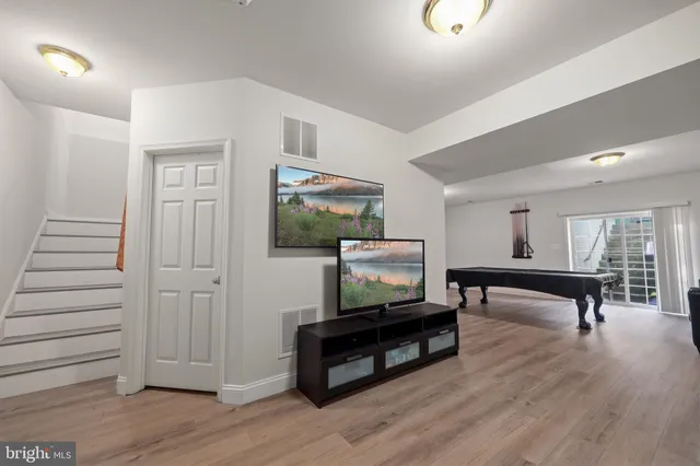 a bathroom with a sink a toilet and shower curtain