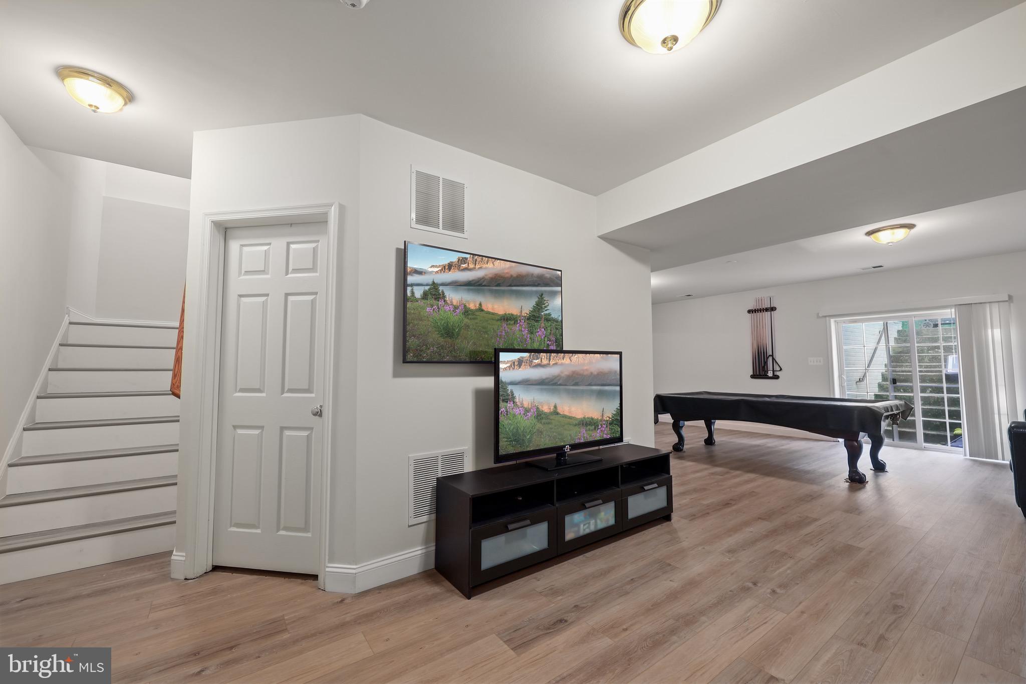 3671 Expedition Drive Triangle, VA 22172 - Photo 44 of 55 a living room with furniture and a flat screen tv