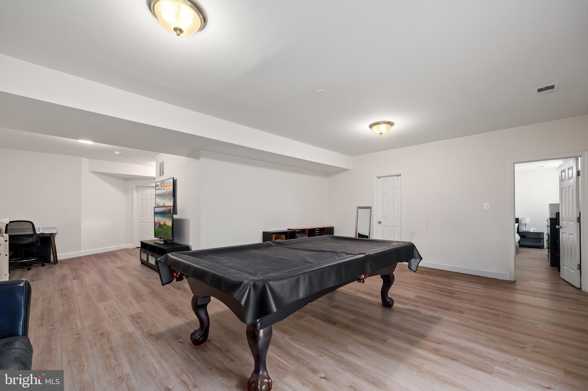 3671 Expedition Drive Triangle, VA 22172 - Photo 45 of 55 a room with furniture and wooden floor
