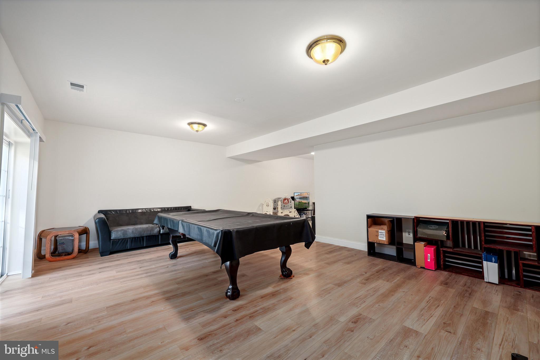 3671 Expedition Drive Triangle, VA 22172 - Photo 46 of 55 a living room with furniture and a wooden floor