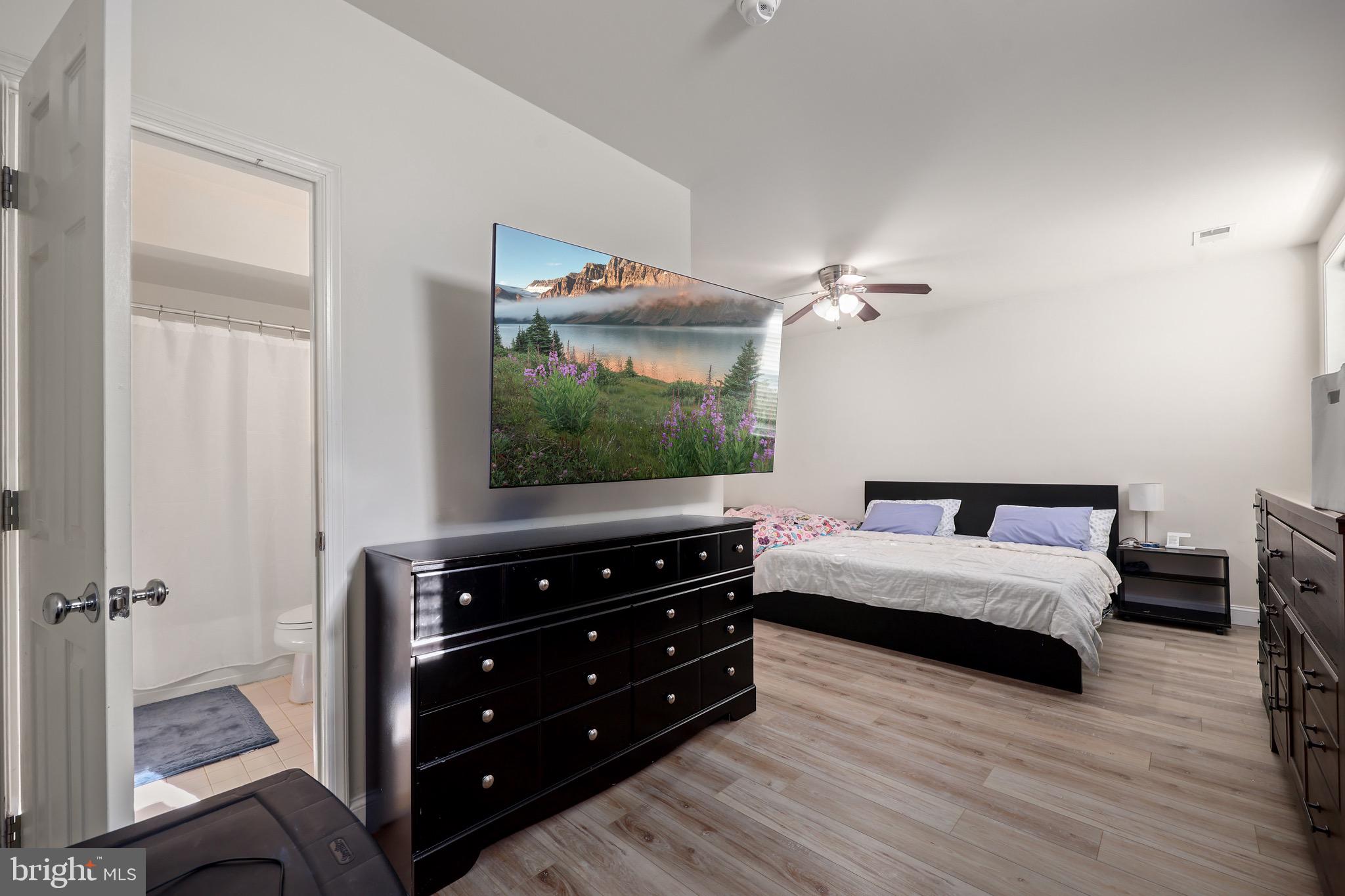 3671 Expedition Drive Triangle, VA 22172 - Photo 47 of 55 a bedroom with a bed and a flat tv screen on dresser