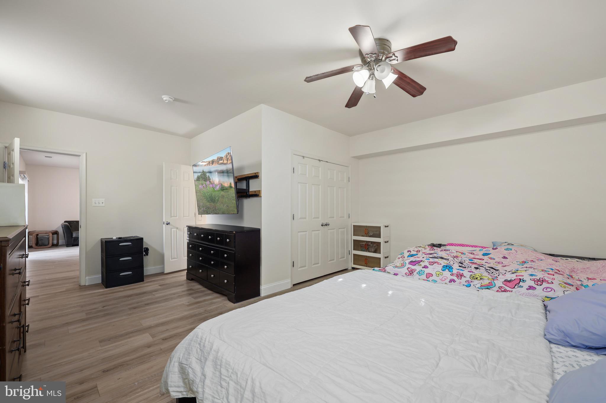 3671 Expedition Drive Triangle, VA 22172 - Photo 48 of 55 a bedroom with bed and wooden floor